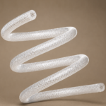 Clear flexible tubing braided with a diamond pattern, coiled in a spring-like shape against a beige background.