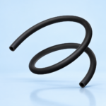 Curved black rubber hose arcing through a pale blue studio background.