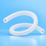 White ribbed flexible hose on a blue background, looped into curves