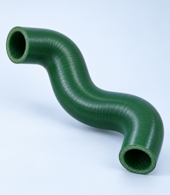 Green flexible industrial hose bent in a sweeping curve, showing braided ends and glossy surface.