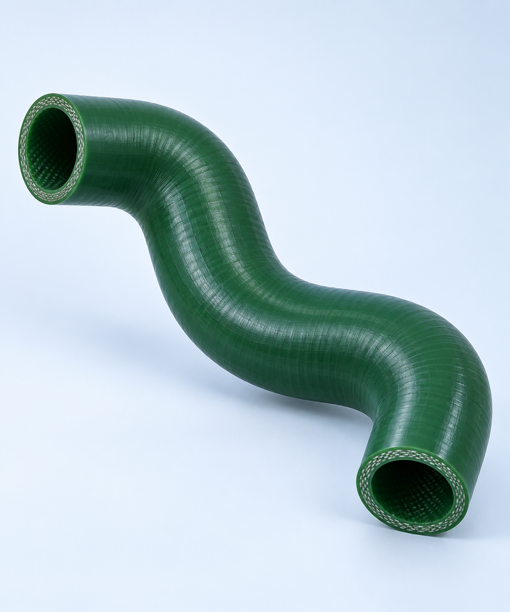 FlowSilTech-OAT_1000x1200 Green flexible industrial hose bent in a sweeping curve, showing braided ends and glossy surface.